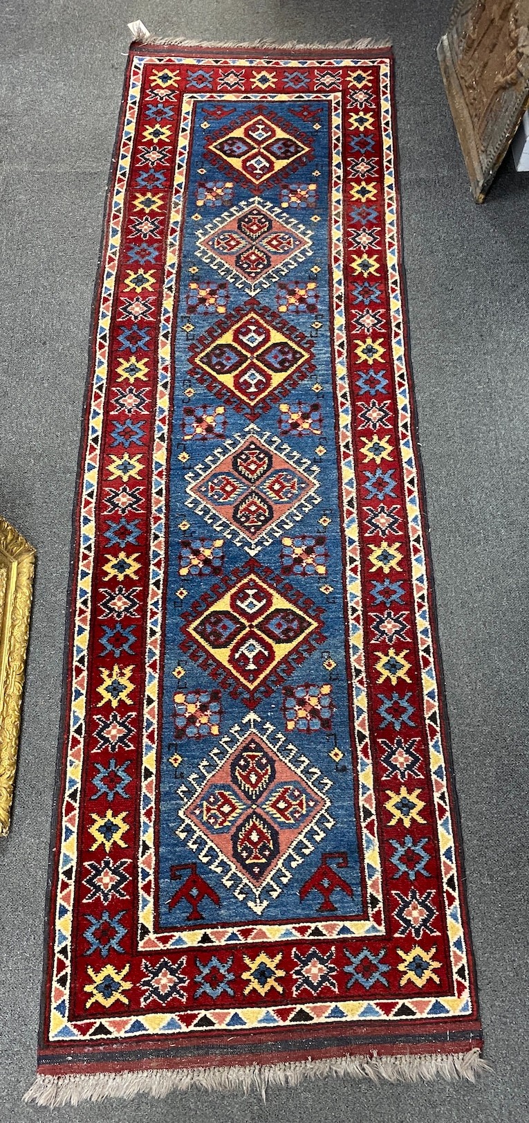 A Caucasian design blue ground runner, 220 x 66cm